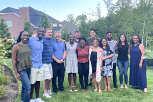 Several members of faculty on a lawn