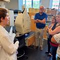 Researcher explaining lab equipment