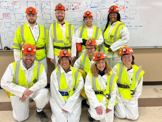 image of students in hardhats and high visibility vests