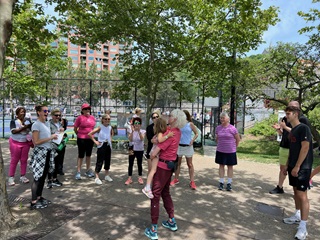 group of people standing in a park