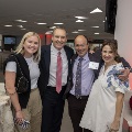 Four people pose together
