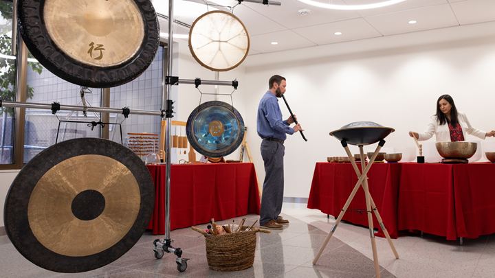 two people leading a sound immersion with various instruments