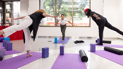 Yoga instructor and class participants in a yoga class