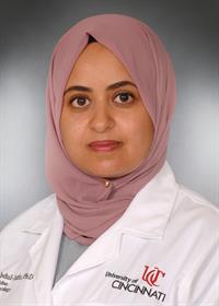 Abdul-Aziz Amina with UC lab coat Abdul-Aziz Amina with UC lab coat