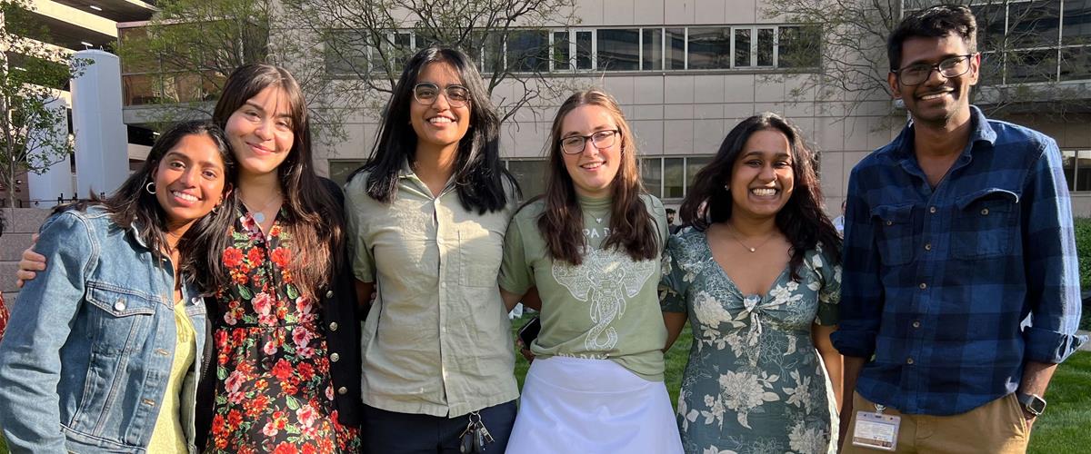 K Lab Members stand arm-and-arm